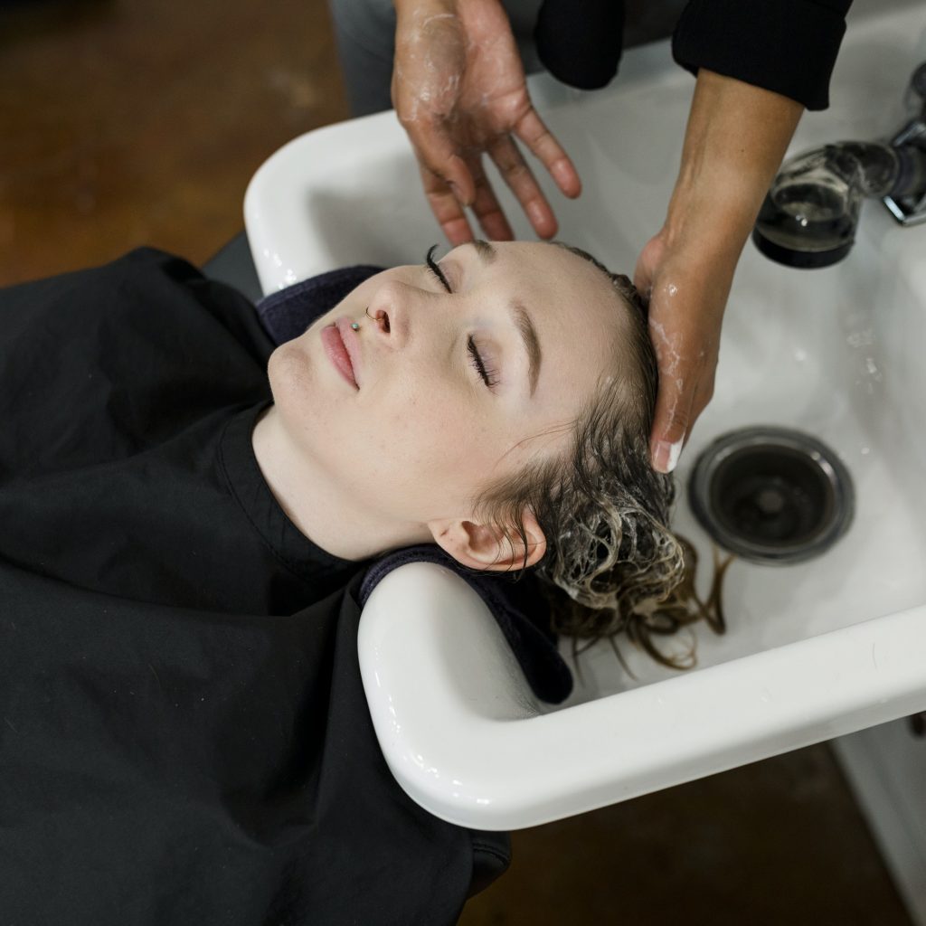 Woman getting a hair wash at a beauty salon